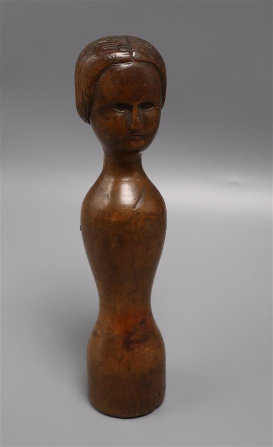 An 18th century primitive carved doll with stamp on base height 25cm